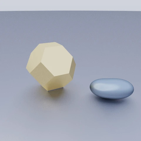 A faceted gold gem beside two grey-blue pebbles blended into a single stone, showing that the new primitives take booleans and blends like any other.
