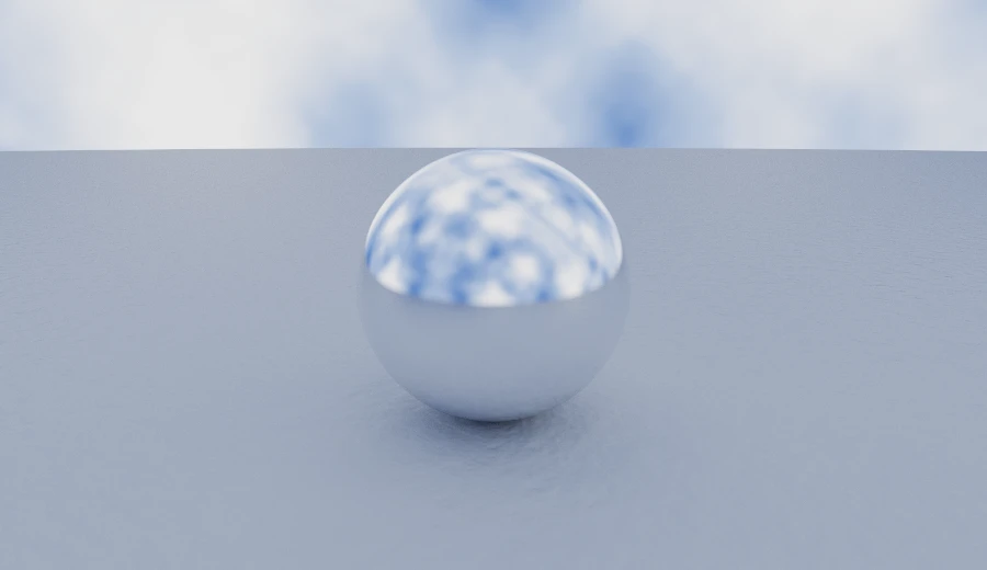 A chrome sphere on a concrete plane under a clouded sky — the smallest scene the fluent API writes.